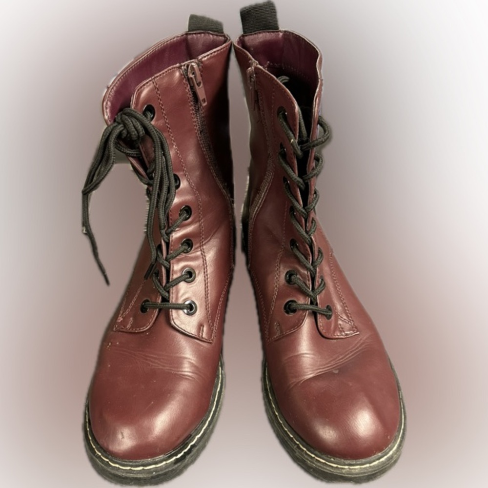 Textile lining with hand made leather outsole. Side zipper. Size 8.5